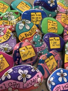 pebbles with inspirations painted on them